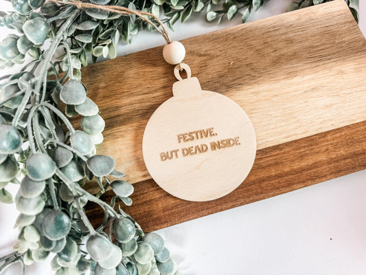 Christmas 2025 Ornament – Round “Festive, But Dead Inside” Wooden Ornament